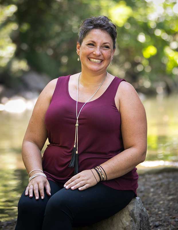 Tracey Duncko seated with cats